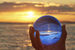 The sun sets over Lake Constance in Germany and lit by a crystal ball.