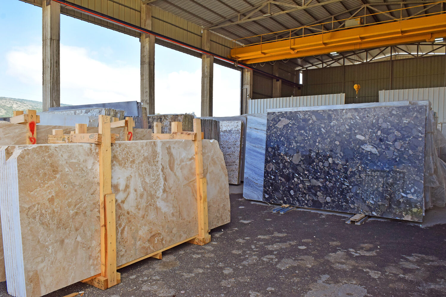 marble factory. various types of marble slabs are in stock ready for further processing