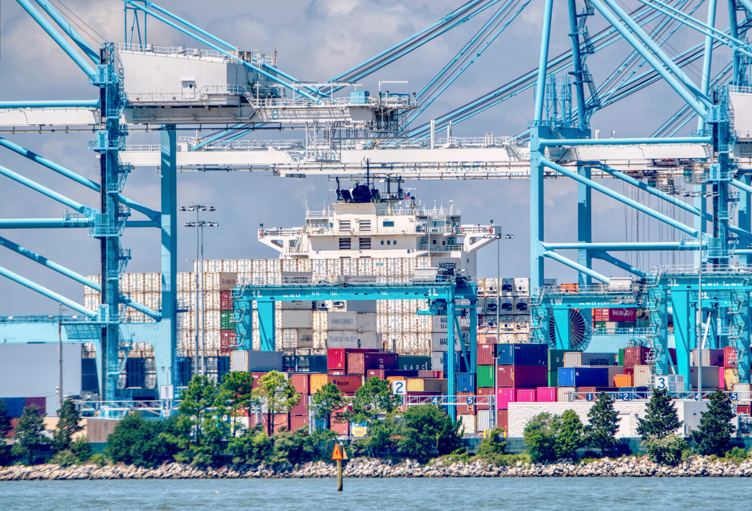 Containerized cargo ship and cranes