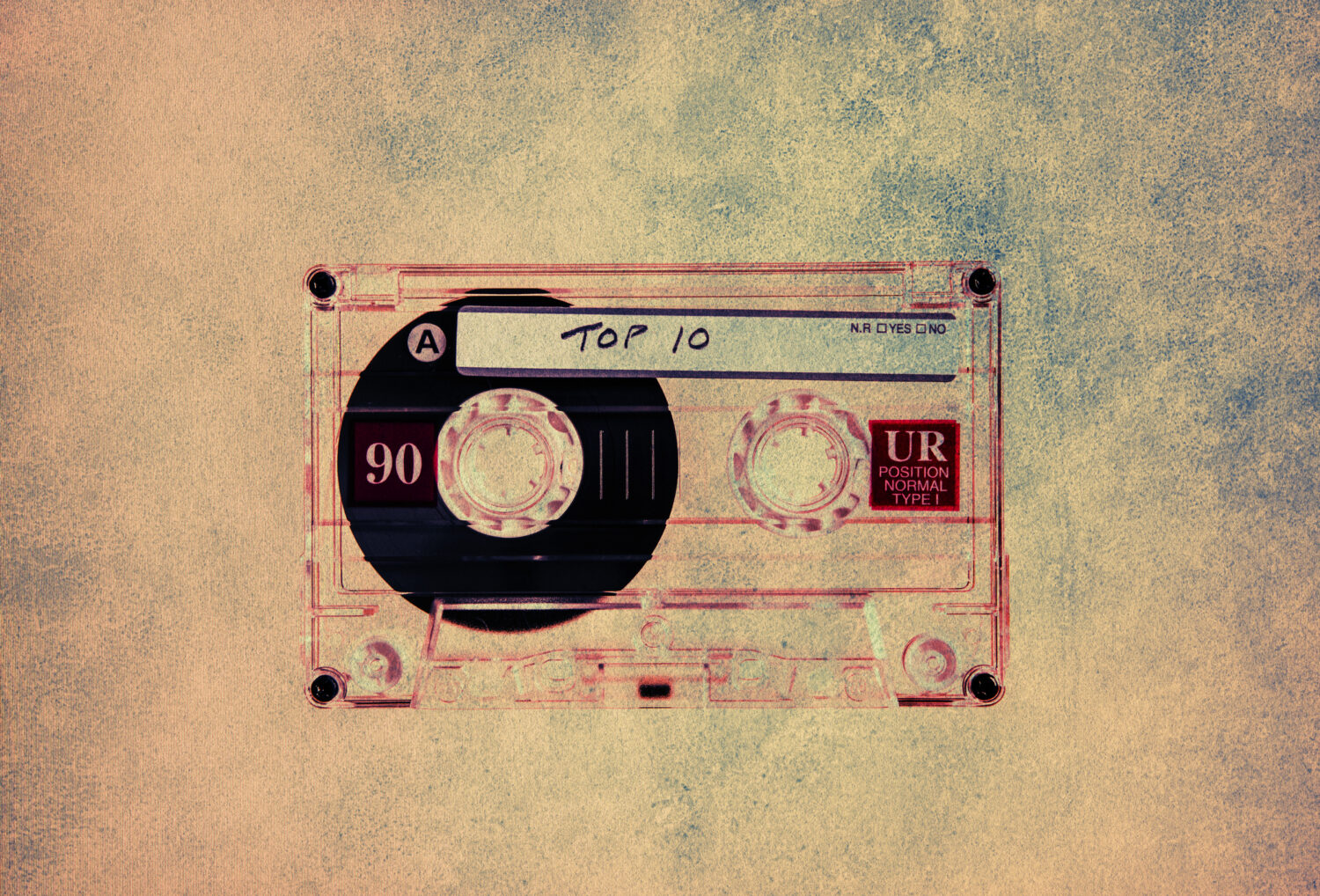 Audio cassette with top ten on cable with textured background