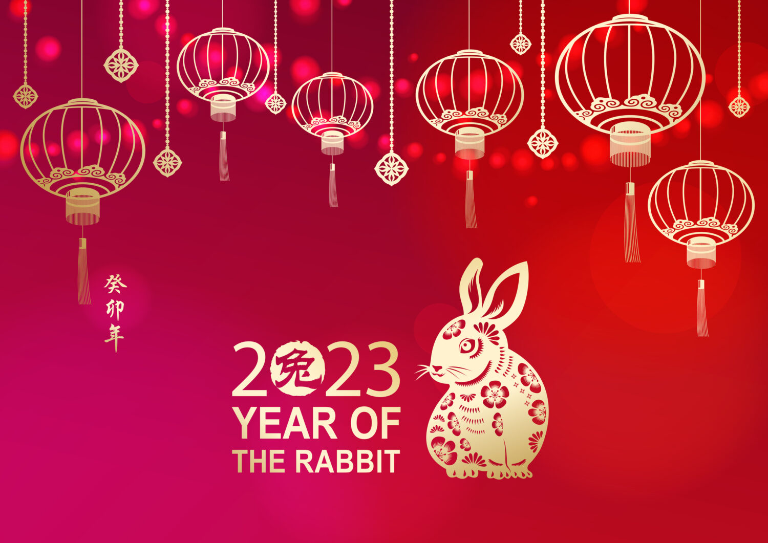 Celebrate the Year of the Rabbit 2023 with lights and gold colored Chinese lanterns and rabbit on the red background, the Chinese stamp means rabbit and the vertical Chinese phrase means Year of the Rabbit according to lunar calendar system